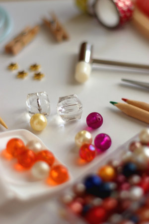 Various craft supplies on white background. Supplies for jewelry making, drawing and needlework. Selective focus.の写真素材