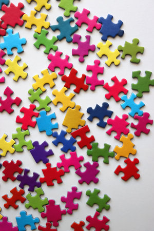 Colorful jigsaw puzzle pieces on white background. Flat lay.の写真素材