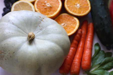 Various seasonal fruits and vegetables on white background. Summer and fall produce. Selective focus.の写真素材