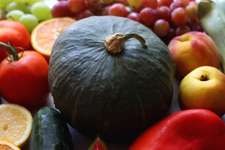 Various seasonal fruits and vegetables on white background. Summer and fall produce. Selective focus.の写真素材