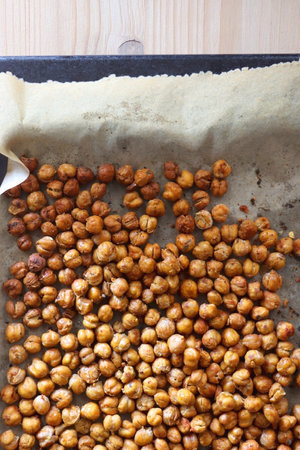 Sheet pan with homemade roasted chickpeas. Top view.の写真素材
