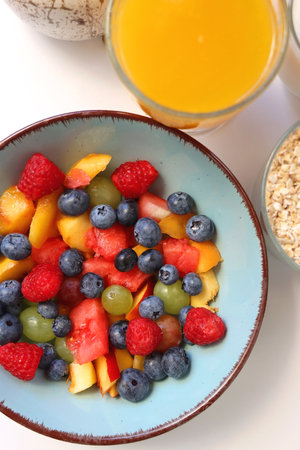 Assortment of various breakfast foods and drinks on the white table. Flat lay.の写真素材