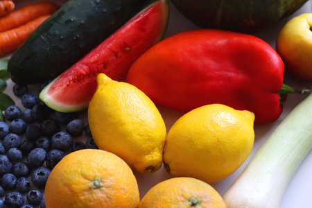 Various seasonal fruits and vegetables on white background. Summer and fall produce. Selective focus.の写真素材