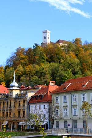 Picturesque historical buildings in central Ljubljana, capital of Slovenia. Autumnal foliage on the trees.の写真素材