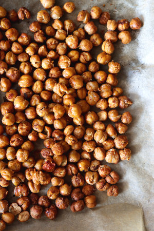 Sheet pan with homemade roasted chickpeas. Top view.の写真素材