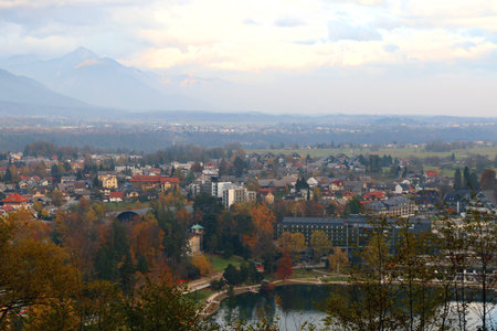 Traditional architecture and beautiful autumn foliage on the coast of Lake Bled, Slovenia.の写真素材