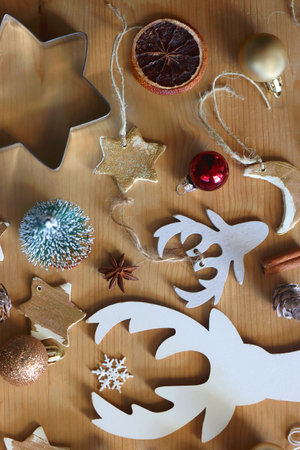 Various Christmas decorations in neutral colors on wooden background. Flat lay.の写真素材