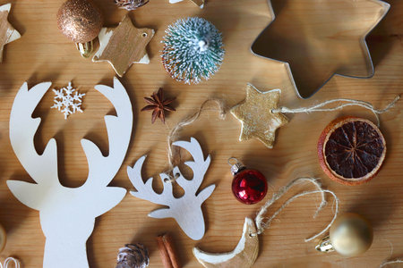 Various Christmas decorations in neutral colors on wooden background. Flat lay.の写真素材