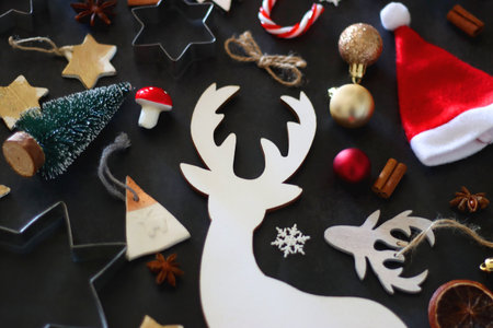 Various Christmas decorations in neutral colors on dark background. Selective focus.の写真素材