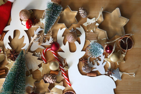 Various Christmas decorations in neutral colors on wooden background. Flat lay.の写真素材