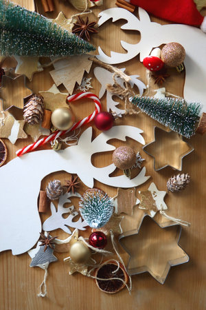 Various Christmas decorations in neutral colors on wooden background. Flat lay.の写真素材