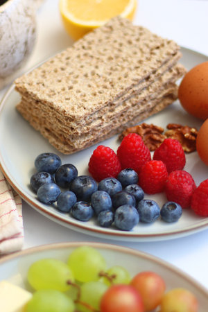 Assortment of various breakfast foods and drinks on the white table. Selective focus.の写真素材