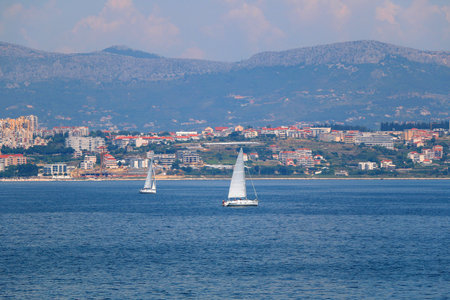 Contemporary buildings, gardens and beaches at the waterfront in Split, Croatia. View of Split from the boat.の写真素材