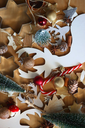 Various Christmas decorations in neutral colors on wooden background. Flat lay.の写真素材