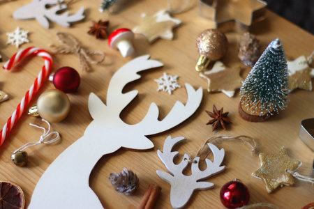 Various Christmas decorations in neutral colors on wooden background. Selective focus.の写真素材