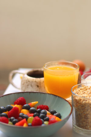 Assortment of various breakfast foods and drinks on the white table. Selective focus.の写真素材