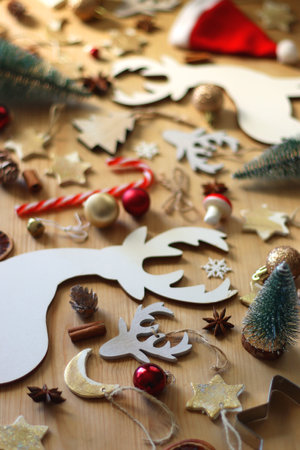 Various Christmas decorations in neutral colors on wooden background. Selective focus.の写真素材