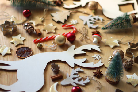 Various Christmas decorations in neutral colors on wooden background. Selective focus.の写真素材