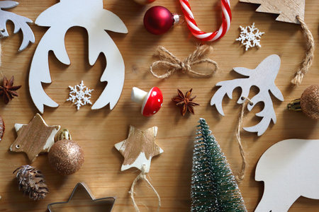 Various Christmas decorations in neutral colors on wooden background. Flat lay.の写真素材
