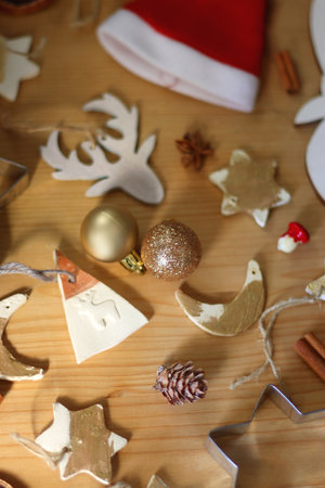 Various Christmas decorations in neutral colors on wooden background. Selective focus.の写真素材