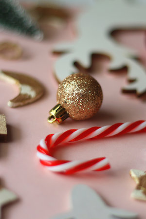 Various cute Christmas ornaments on pale pink background. Selective focus.の写真素材