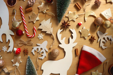 Various Christmas decorations in neutral colors on wooden background. Flat lay.の写真素材