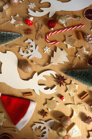 Various Christmas decorations in neutral colors on wooden background. Flat lay.の写真素材