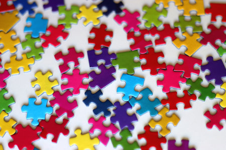 Colorful jigsaw puzzle pieces on white background. Selective focus.の写真素材