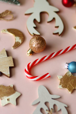 Various cute Christmas ornaments on pale pink background. Selective focus.の写真素材