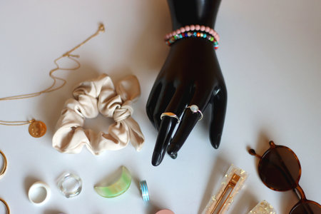 Colorful friendship bracelets, necklaces, various beads and DIY supplies on the table. Making jewelry at home. Selective focus.の写真素材