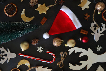 Various Christmas decorations in neutral colors on dark background. Top view.の写真素材