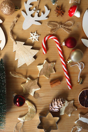 Various Christmas decorations in neutral colors on wooden background. Flat lay.の写真素材
