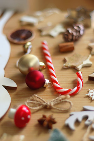 Various Christmas decorations in neutral colors on wooden background. Selective focus.の写真素材