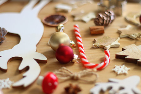 Various Christmas decorations in neutral colors on wooden background. Selective focus.の写真素材