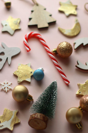Various cute Christmas ornaments on pale pink background. Selective focus.の写真素材