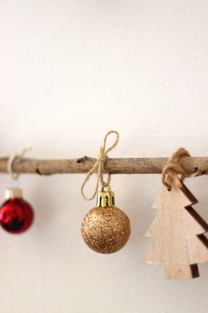 Cute Christmas tree ornaments, hanging on the branches. Selective focus.の写真素材
