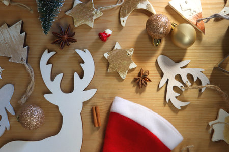 Various Christmas decorations in neutral colors on wooden background. Flat lay.の写真素材