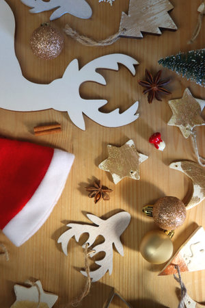 Various Christmas decorations in neutral colors on wooden background. Flat lay.の写真素材