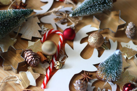 Various Christmas decorations in neutral colors on wooden background. Selective focus.の写真素材