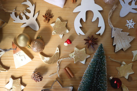 Various Christmas decorations in neutral colors on wooden background. Flat lay.の写真素材