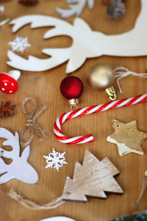 Various Christmas decorations in neutral colors on wooden background. Selective focus.の写真素材