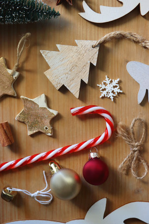 Various Christmas decorations in neutral colors on wooden background. Flat lay.の写真素材