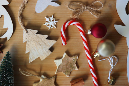 Various Christmas decorations in neutral colors on wooden background. Flat lay.の写真素材