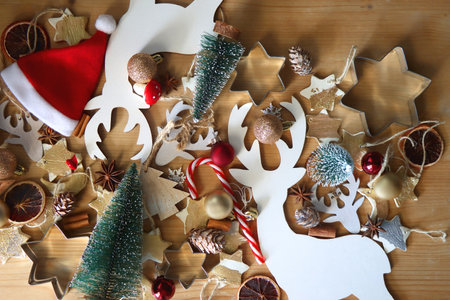 Various Christmas decorations in neutral colors on wooden background. Flat lay.の写真素材