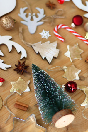 Various Christmas decorations in neutral colors on wooden background. Selective focus.の写真素材