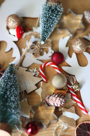 Various Christmas decorations in neutral colors on wooden background. Selective focus.の写真素材