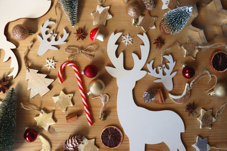 Various Christmas decorations in neutral colors on wooden background. Flat lay.の写真素材