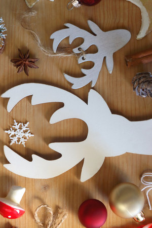 Various Christmas decorations in neutral colors on wooden background. Flat lay.の写真素材