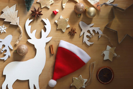 Various Christmas decorations in neutral colors on wooden background. Flat lay.の写真素材