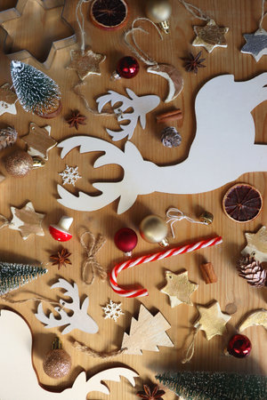 Various Christmas decorations in neutral colors on wooden background. Flat lay.の写真素材